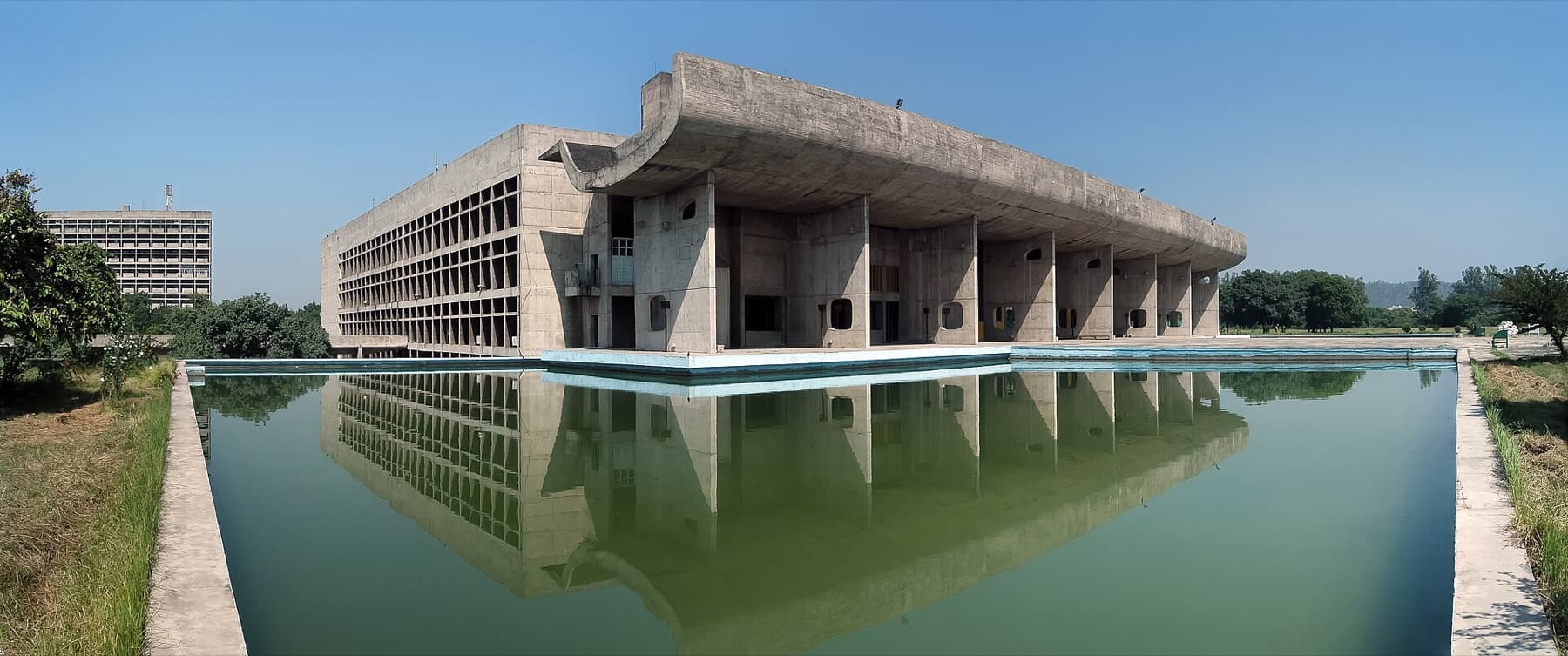 Le Corbusier's Palace of Assembly reflected in its pool, Capitol Complex, Chandigarh