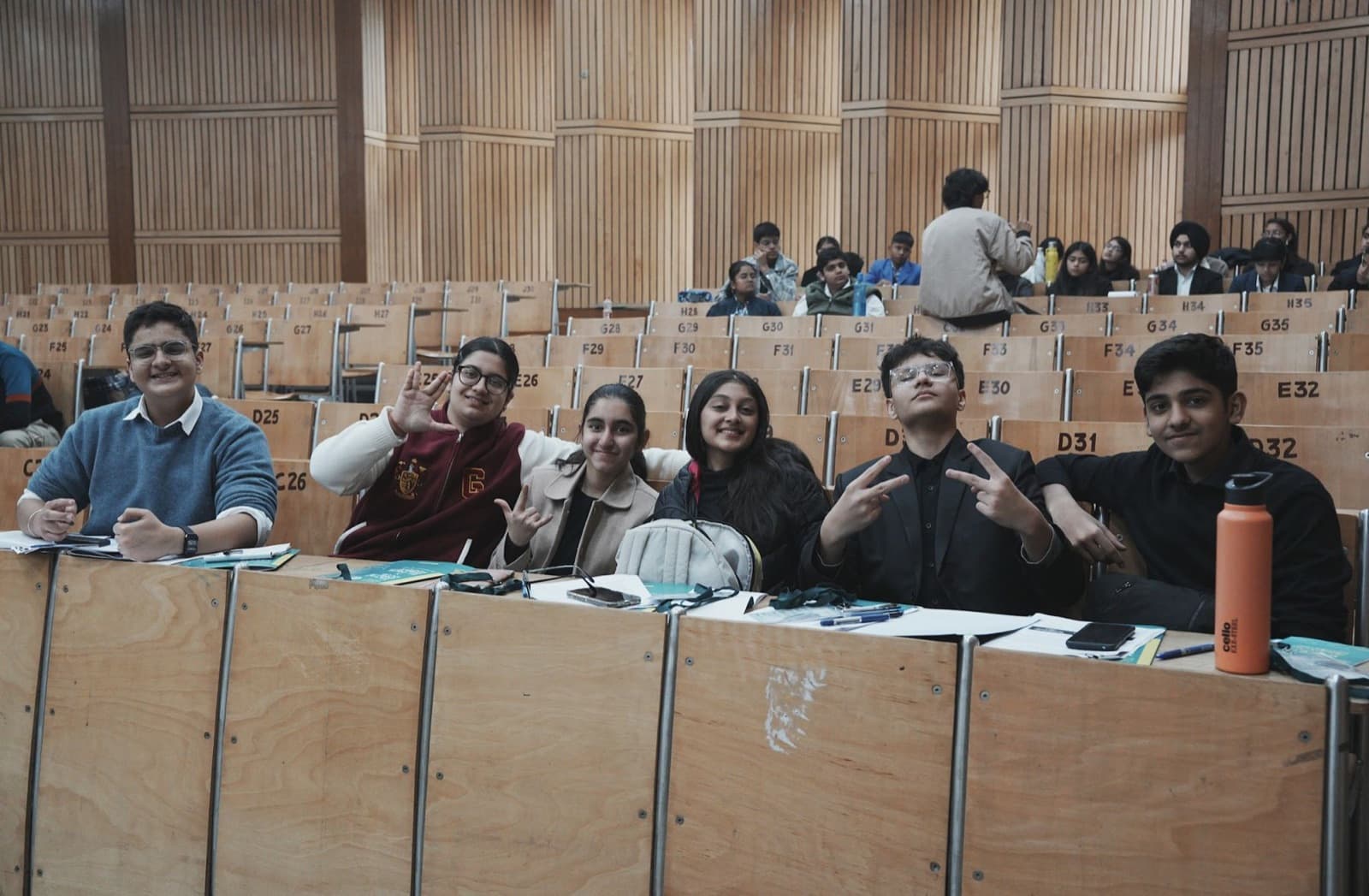 Students at their desks in a university lecture hall during a bootcamp