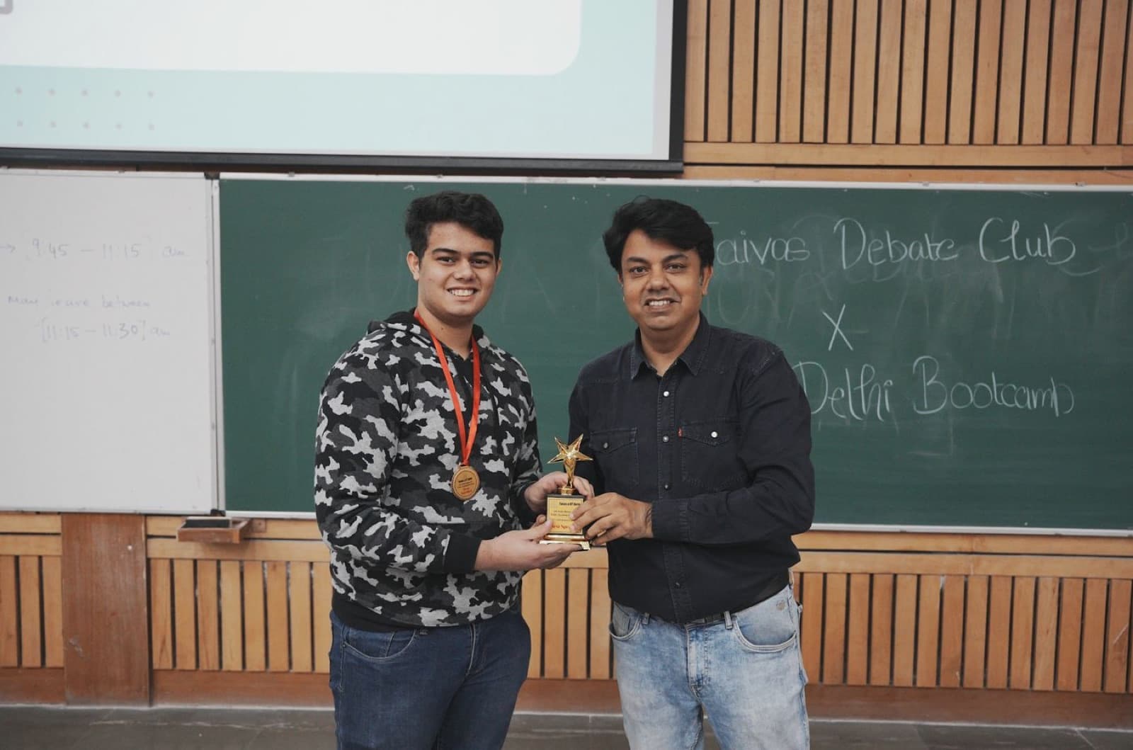A student receiving a medal