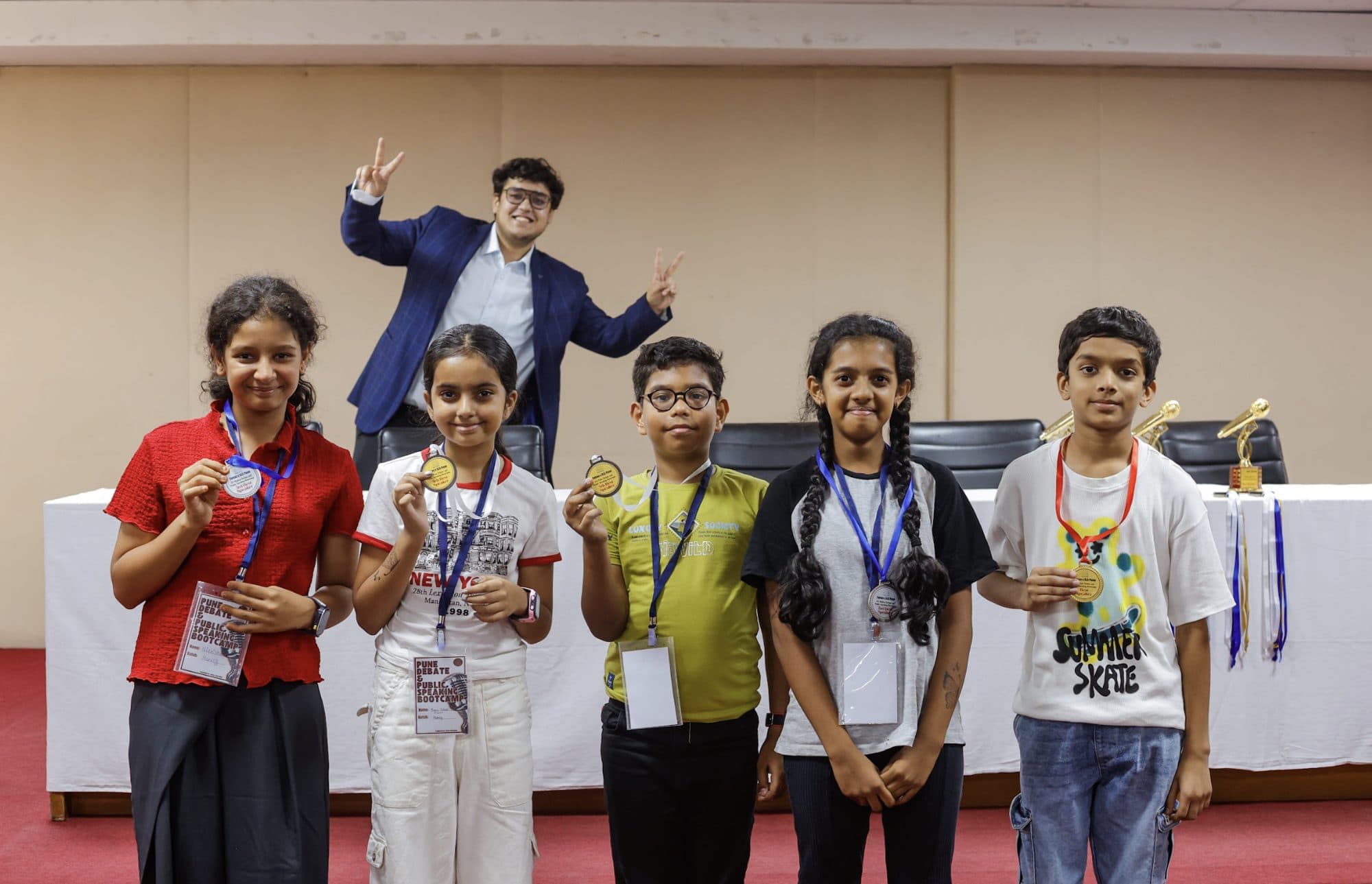 Junior Taivas speakers with their medals